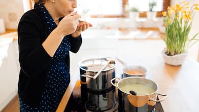 Pots steaming on electric cooktop in kitchen