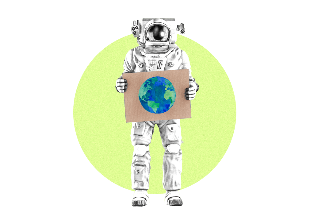 Astronaut holding cardboard sign with earth painted on it