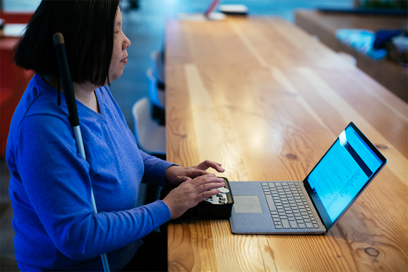 Photo of Microsoft employee Anne at a computer