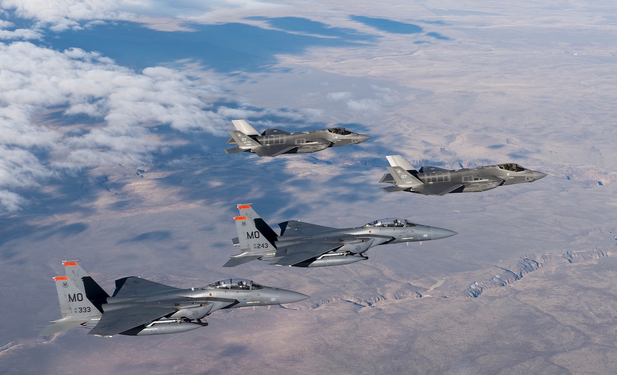 Two F-35 Lightning II fighter jets from the 31st Test and Evaluation Squadron and two F-15E Strike Eagles from the 389th Fighter Squadron fly over the range near Mountain Home Air Force Base, Idaho, Feb. 17, 2016.