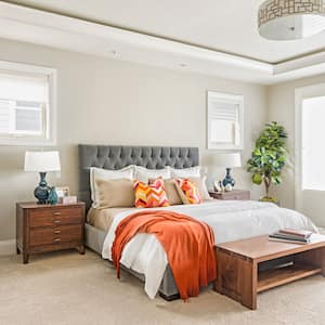 A beautiful bright carpeted bedroom