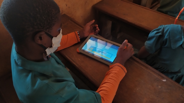 A school child in Cameroon uses WikiFundi to take part in the WikiChallenge drive in 2021