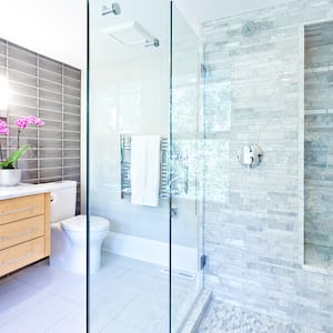 Bright contemporary bathroom with marble tiles