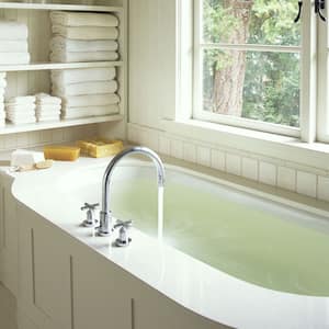 Water running in bathtub with white paneling