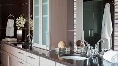 gray bathroom sink vanity with mirrors