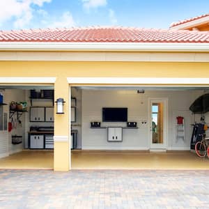 A well organized residential garage with storage cabinets