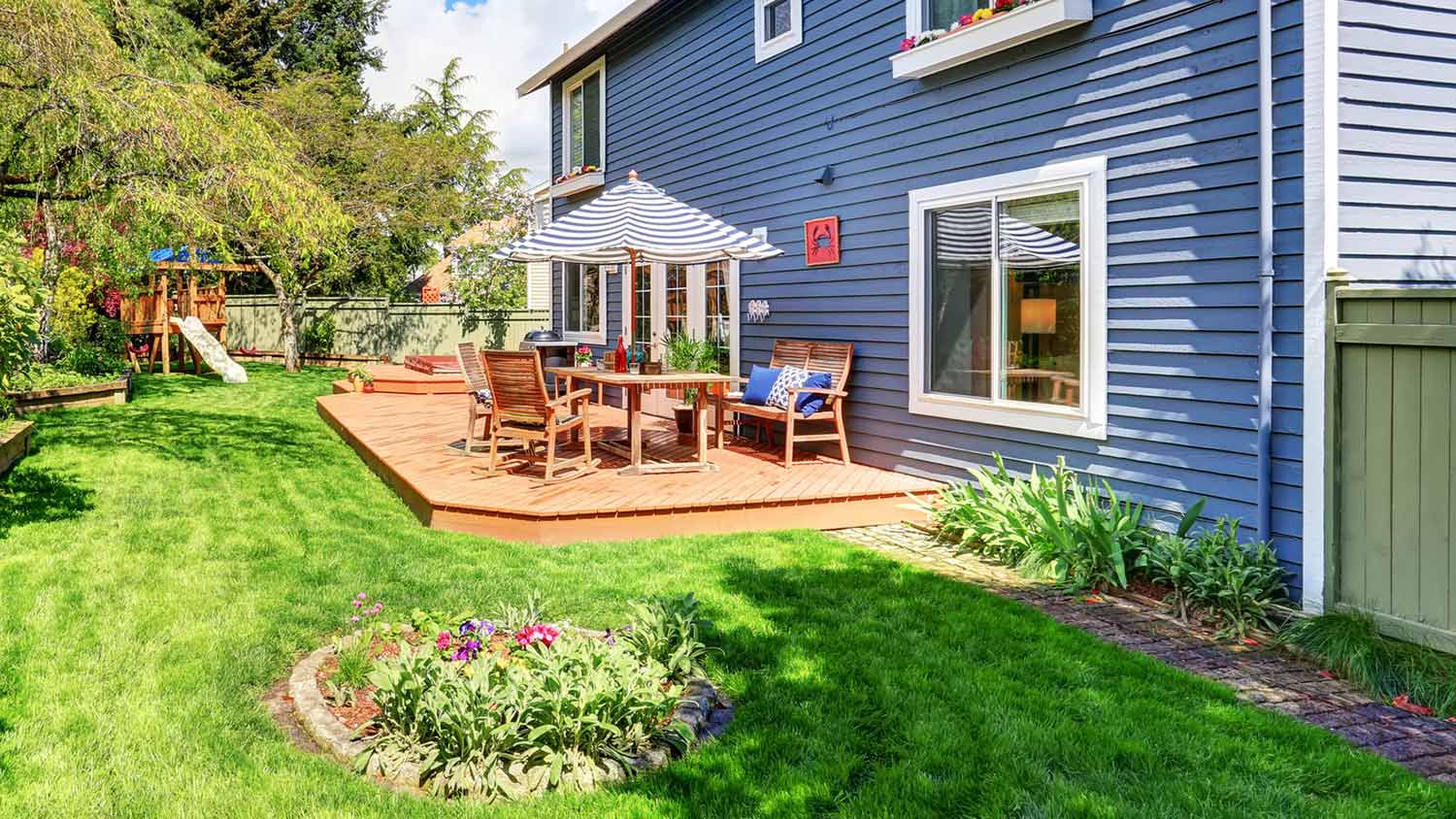 Small backyard deck made of wood and stained