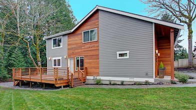 Large house with deck and backyard