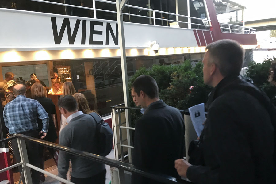 People boarding river cruise