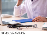 Young male doctor in telemedicine concept. Стоковое фото, фотограф Elnur / Фотобанк Лори