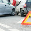 Accident or crash with two automobile. Road warning triangle sign in focus. Стоковое фото, фотограф Дмитрий Калиновский / Фотобанк Лори