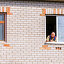 an elderly man looks out of the window of his large house on a sunny day. Стоковое фото, фотограф Акиньшин Владимир / Фотобанк Лори