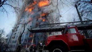 Firefighters battle a blaze in Kyiv