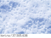 Melting snowdrift surface on a sunny day, top view. Стоковое фото, фотограф EugeneSergeev / Фотобанк Лори