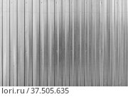 Shiny ridged metal wall, background texture. Стоковое фото, фотограф EugeneSergeev / Фотобанк Лори