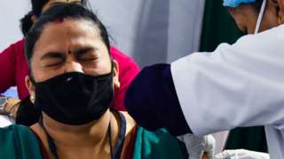 A medical worker inoculates a colleague with a Covid-19 vaccine at a hospital in Guwahati on January 16, 2021