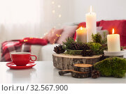 cup of tea with burning candles on white table. Стоковое фото, фотограф Майя Крученкова / Фотобанк Лори