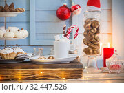 Christmas bar cacao decoration with cookies and sweets on blue wooden background in vintage style. Стоковое фото, фотограф Майя Крученкова / Фотобанк Лори