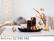 black burning candles with Christmas balls in white interior. Стоковое фото, фотограф Майя Крученкова / Фотобанк Лори