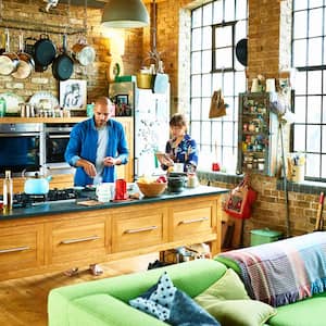 A family cooking dinner at their kitchen