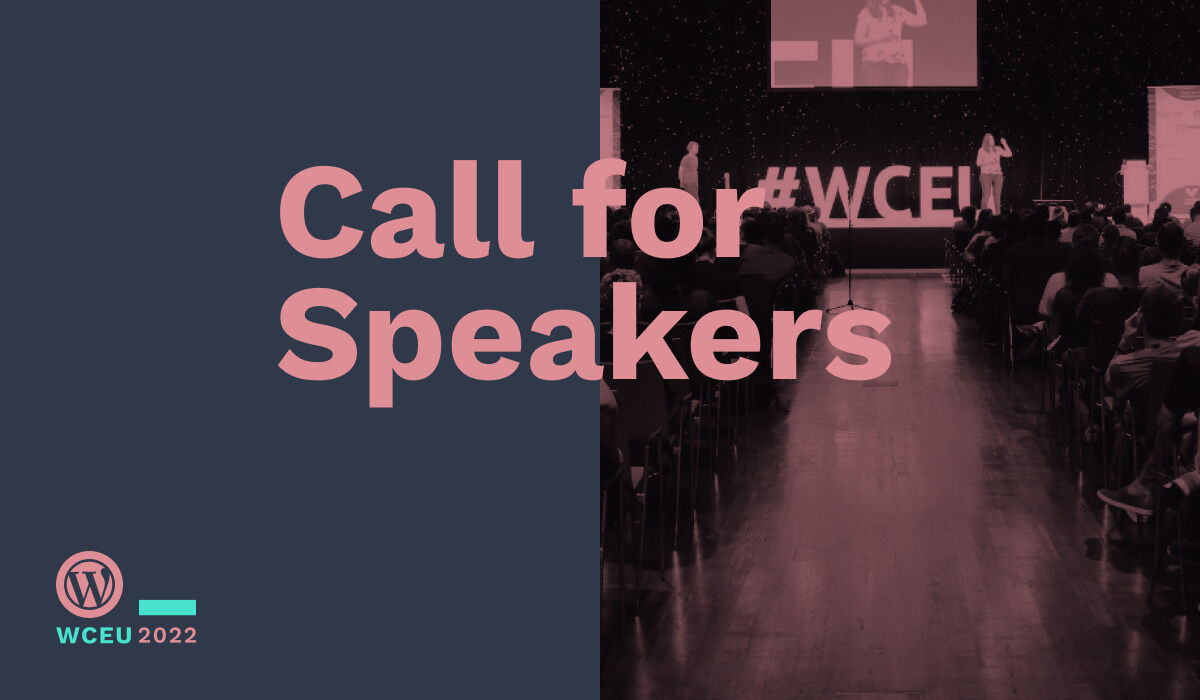 Cover Image for Call for Speakers.
Image showing large hall with audience and speakers on stage.