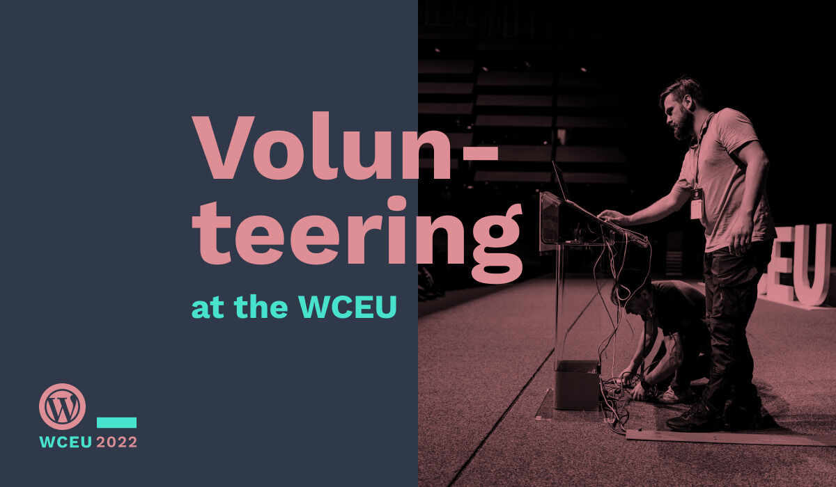 Volunteering at the WCEU. Image shows two volunteers setting up a laptop on the speaker's stage.