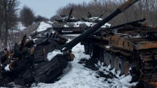 A charred Russian tank and captured tanks are seen, amid Russia's invasion of Ukraine, in the Sumy region