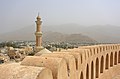 Nizwa Fort and Minaret of Friday Mosque.JPG