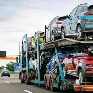 Cars carrier truck at asphalt highway road