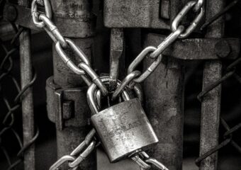 padlock securely attached to fence