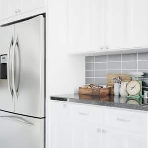 a silver refrigerator in a modern kitchen