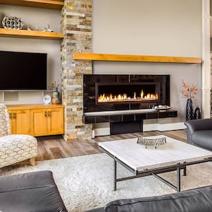 Large electric fireplace set in a bright modern living room