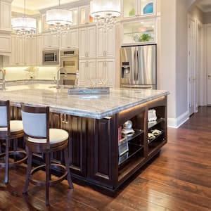 A kitchen with a custom kitchen island and stacked cabinets