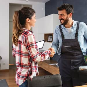 woman conducting business with repairman