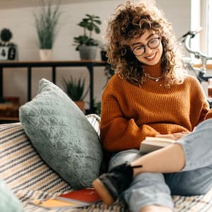 A female student sitting on sofa