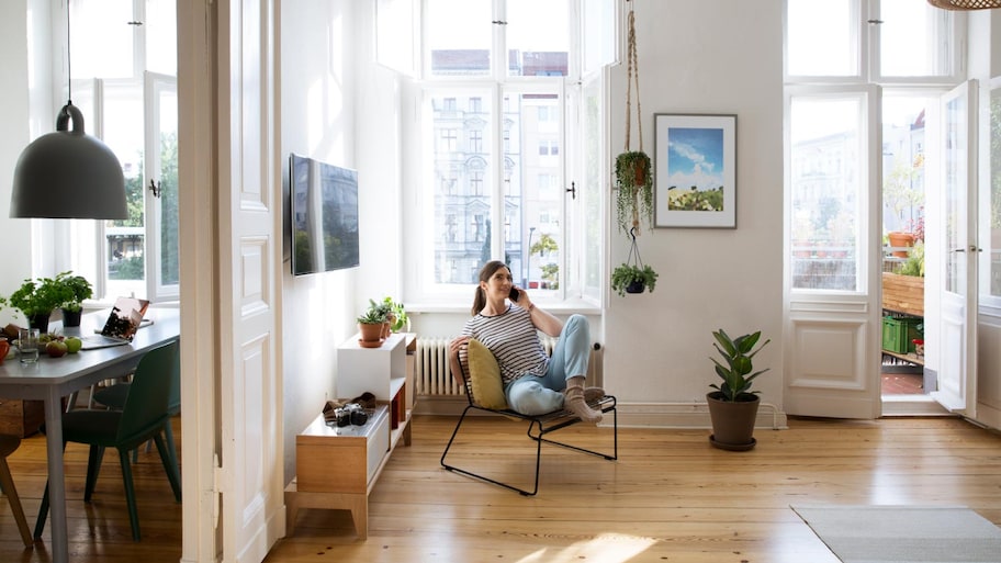 A woman at home sitting in her chair