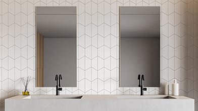 A modern white tile bathroom with a double sink