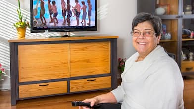 woman with tv and stand