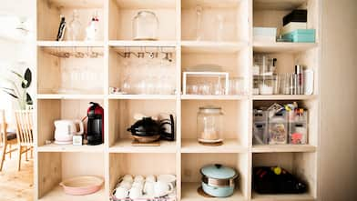 A wooden shelving unit in the living room