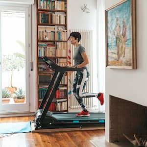 woman running on treadmill in living room setting