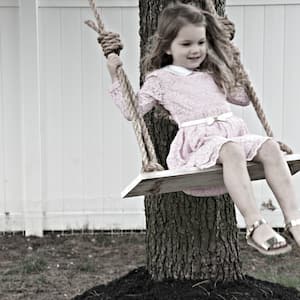girl on rope tree swing