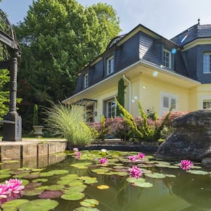 Art nouveau villa, 1929 with a lily pond