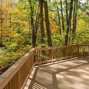 A large deck overlooking the woods