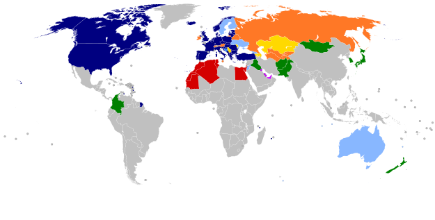 A world map with countries in blue, cyan, orange, yellow, purple, and green, based on their NATO affiliation.