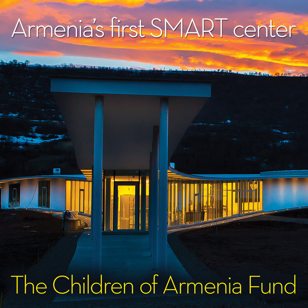 Sunset behind the COAF center with the words Armenian’s first SMART center.