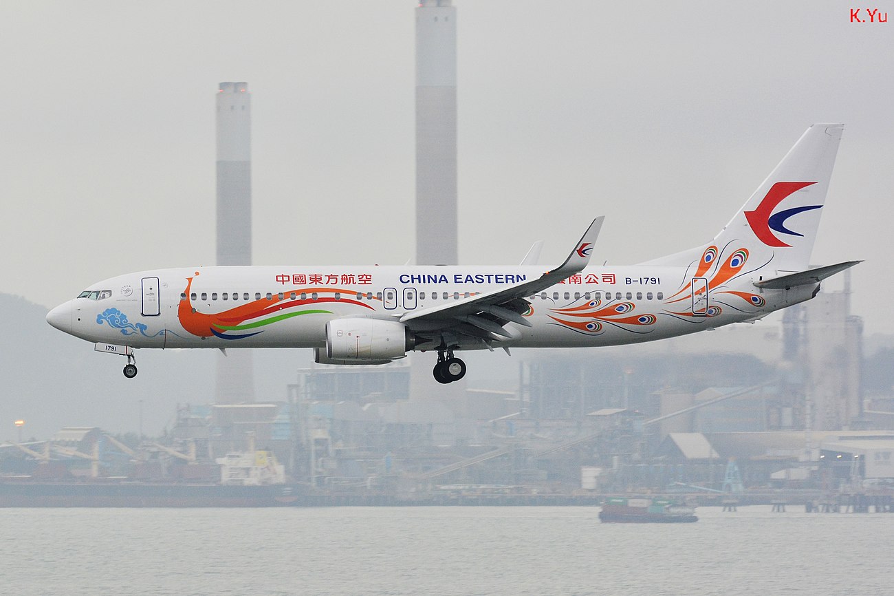 Boeing 737-89P China Eastern Airlines (Orange Yunnan Peacock) B-1791 HKG.jpg