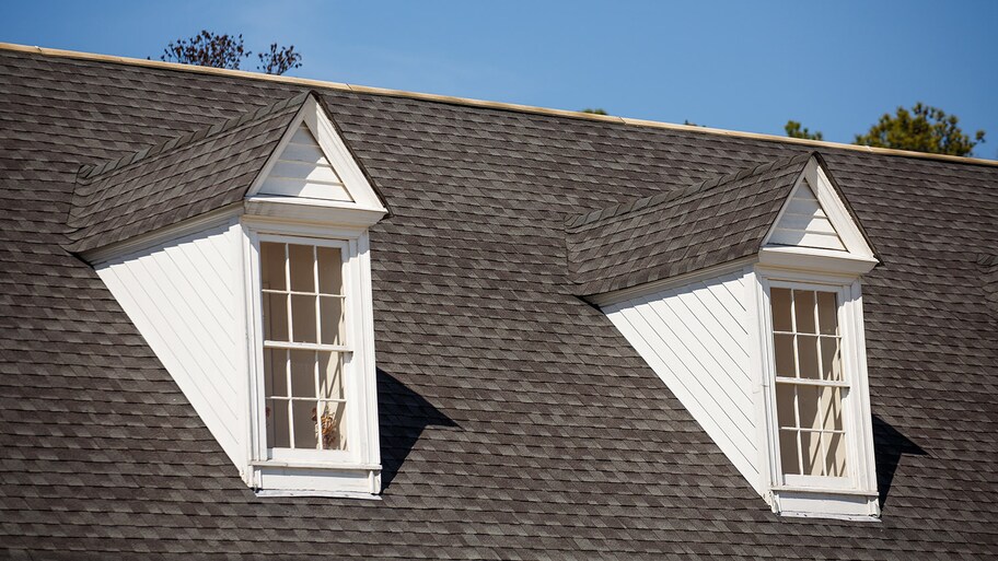 grey roof with white dormers 