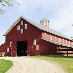 big red barn on a farm  