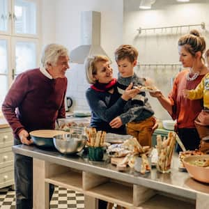 Family preparing Thanksgiving dinner in the kitchen