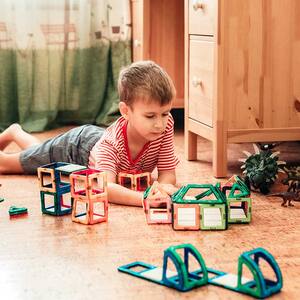 Boy playing on cork flooring